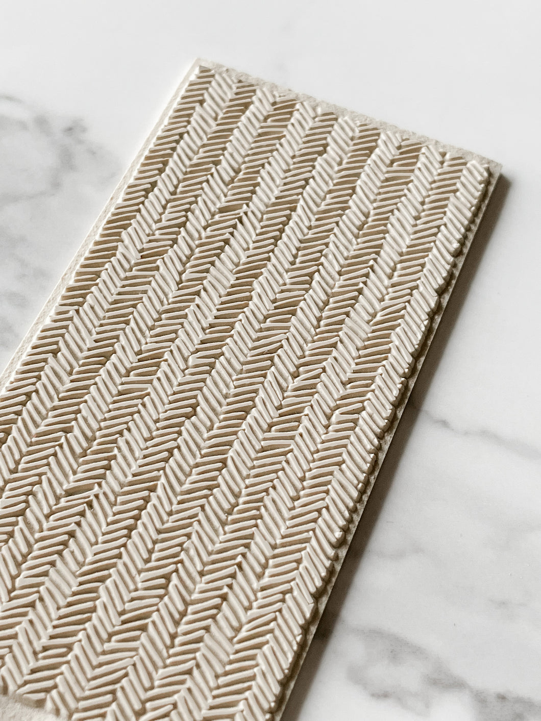 Smudged Herringbone Texture Tile